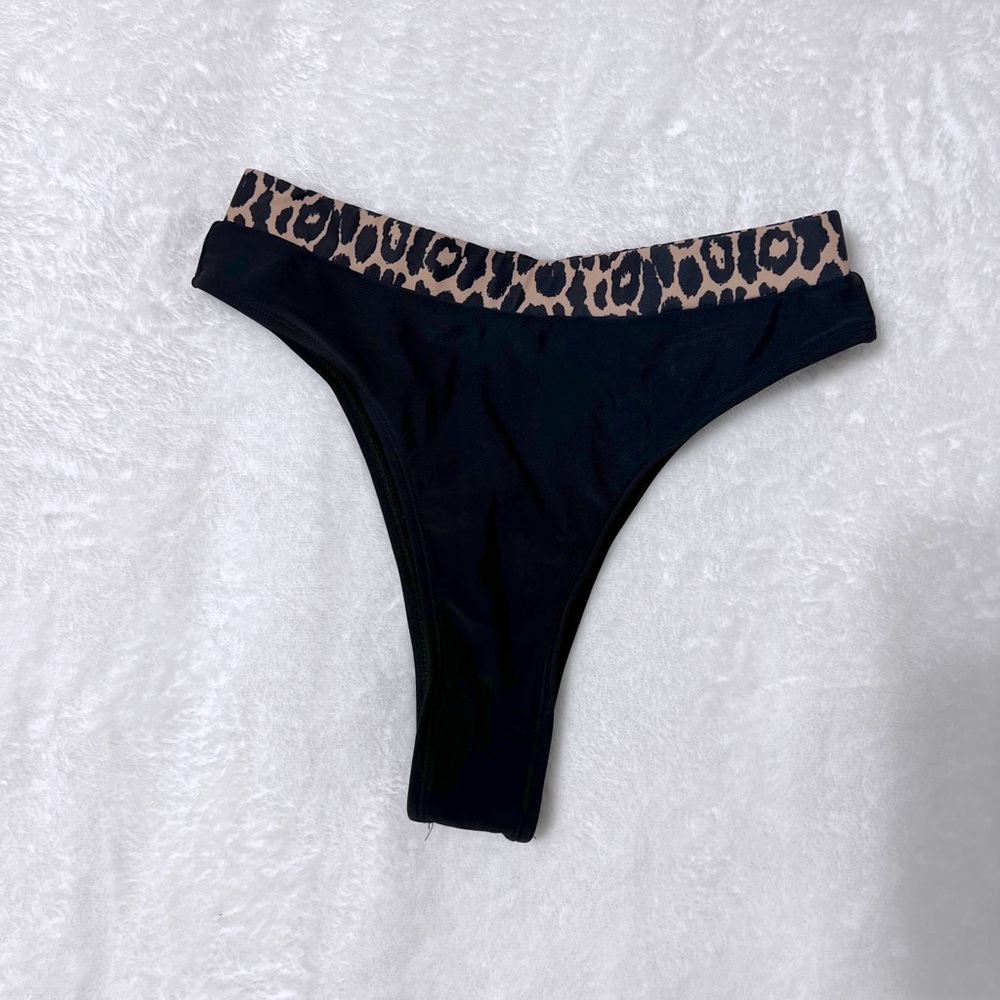 black bathing suit bottoms with cheetah print waistband